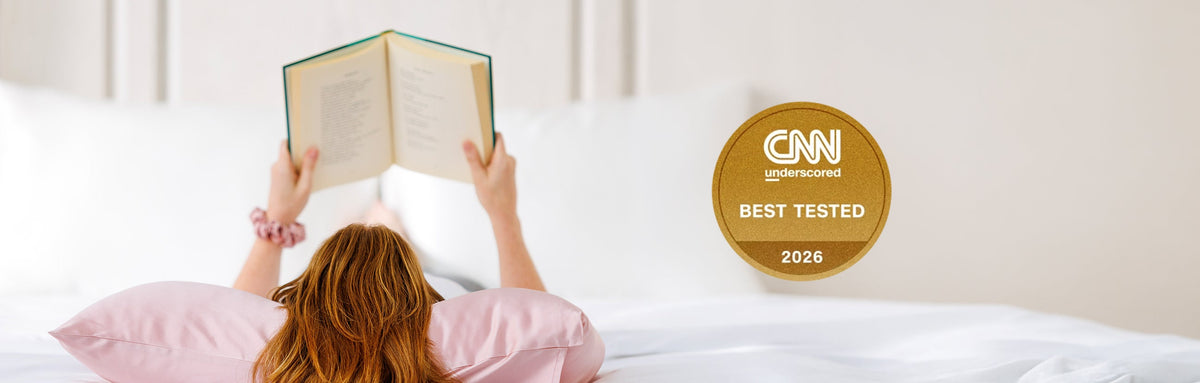 woman laying on silk pillowcase. Named best silk pillowcase of 2026 by CNN Underscored
