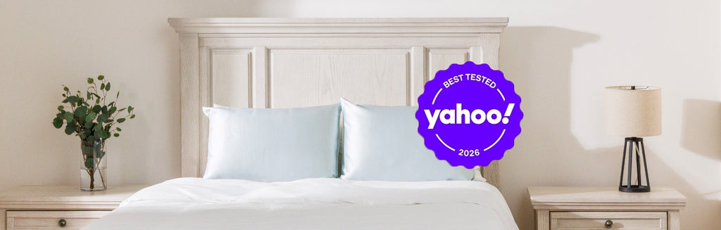 Bedroom with silk pillowcases on a bed. "Yahoo!" shopping seal overlayed on the image.