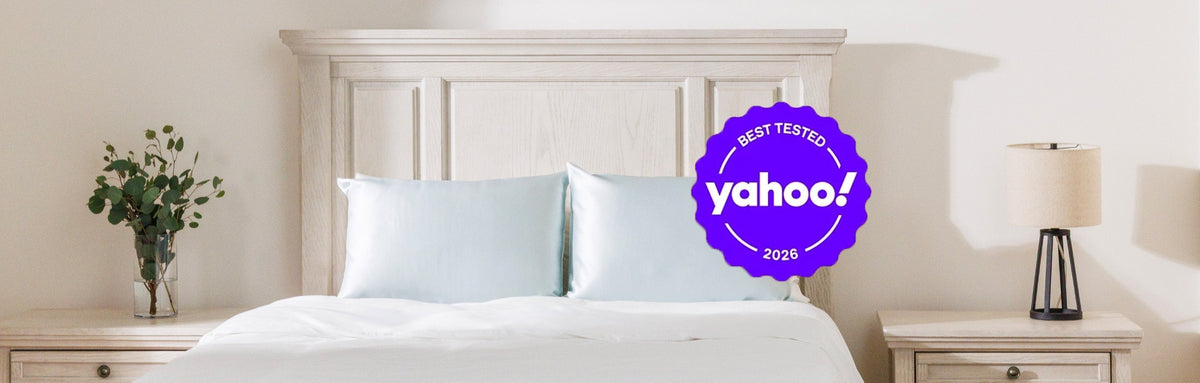 Bedroom with silk pillowcases on a bed. "Yahoo!" shopping seal overlayed on the image.