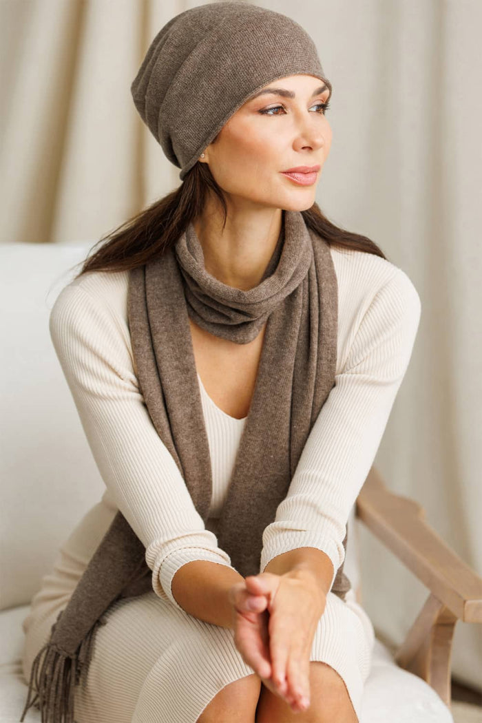Soft silk blend beanie in cappuccino brown with matching scarf fringe detail.