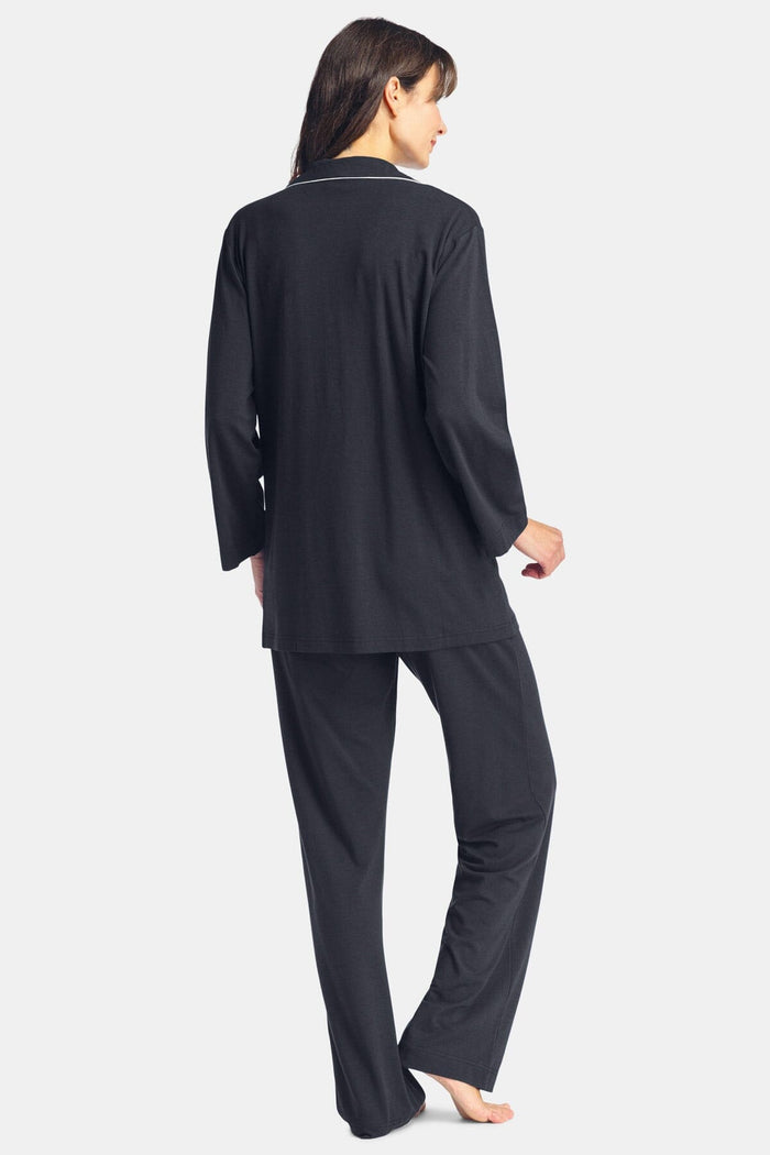 Black silk long-sleeve pajama top and matching pants set with relaxed fit and collar.