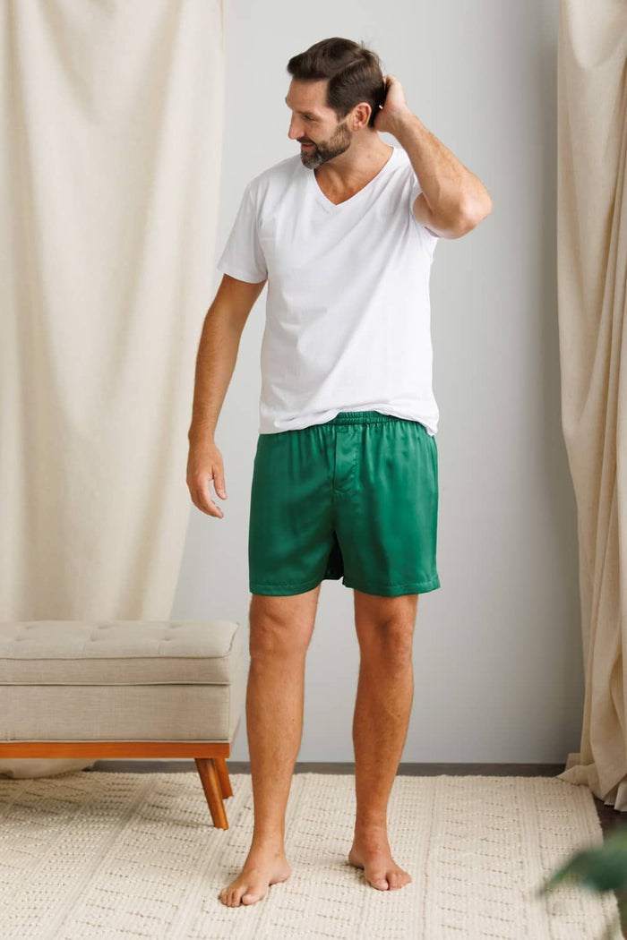 Hunter green silk men's shorts with elastic waistband and relaxed fit.