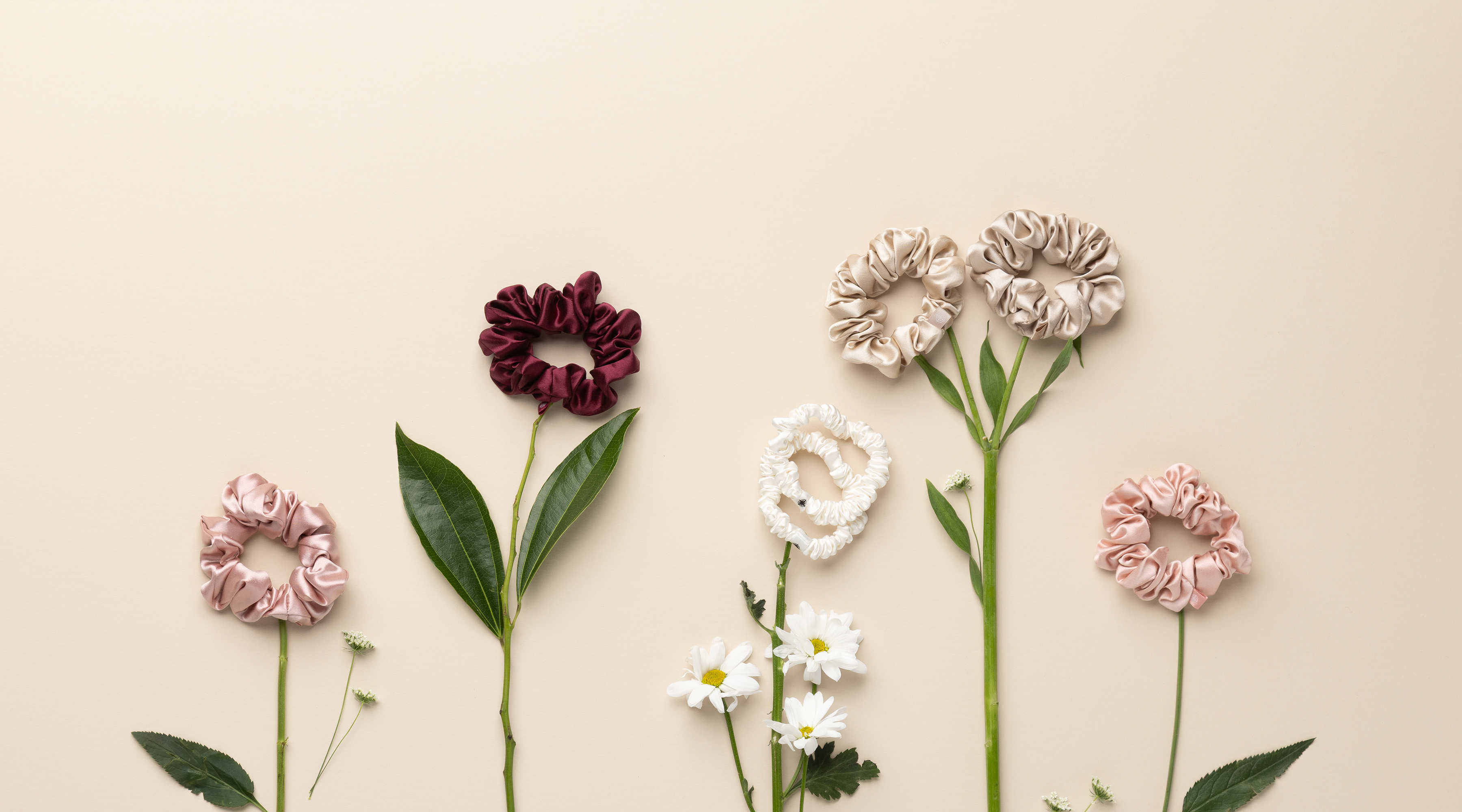 Decorative flowers with scrunchies on a beige background