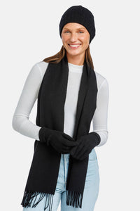 women wearing black cashmere hat glove and scarf set over a white top and jeans