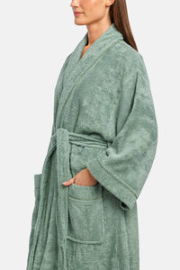 Lily green terry cloth robe with kimono sleeves, waist tie, and front pockets.