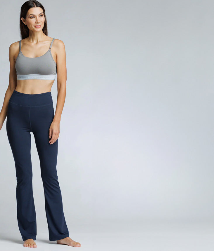 Woman wearing navy yoga pants.