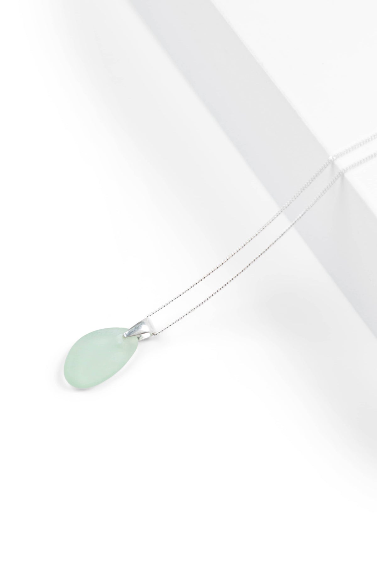 Seafoam sea glass teardrop pendant on delicate silver chain.